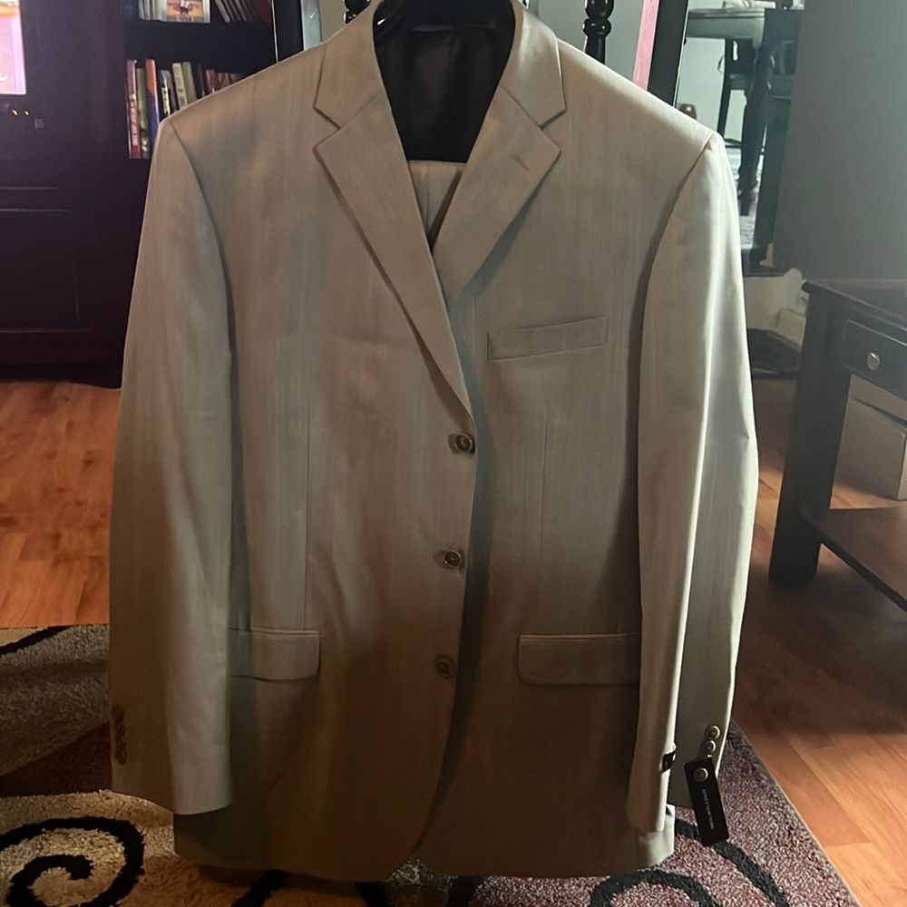 Jones New York Two Piece Tan pin striped Suit. Men’s size 46L/40.5 W.